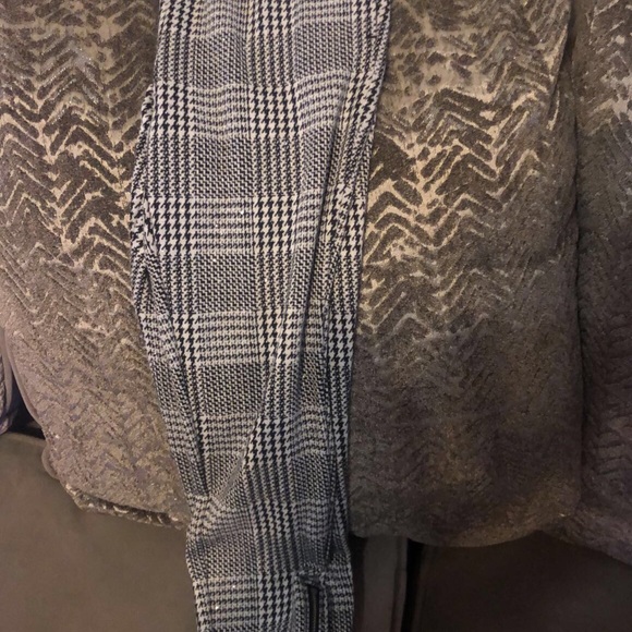 Black and white Checkered pants with zippers on the side of pants legs. - Picture 3 of 5